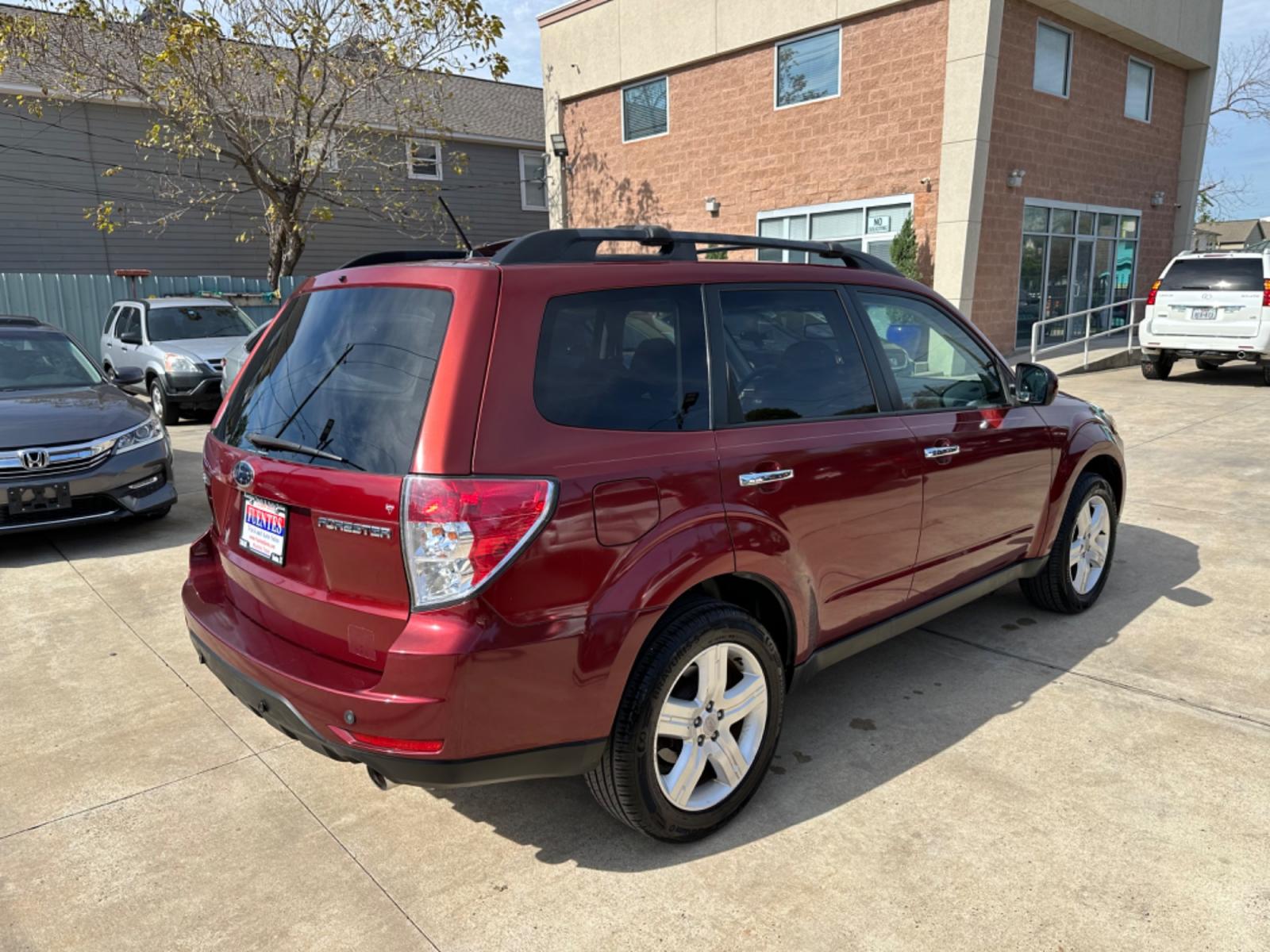 2009 Red /Black Subaru Forester X Limited (JF2SH64619H) with an 2.5 engine, Automatic transmission, located at 1501 West 15th St., Houston, 77008, (713) 869-2925, 29.797941, -95.411789 - Photo #2